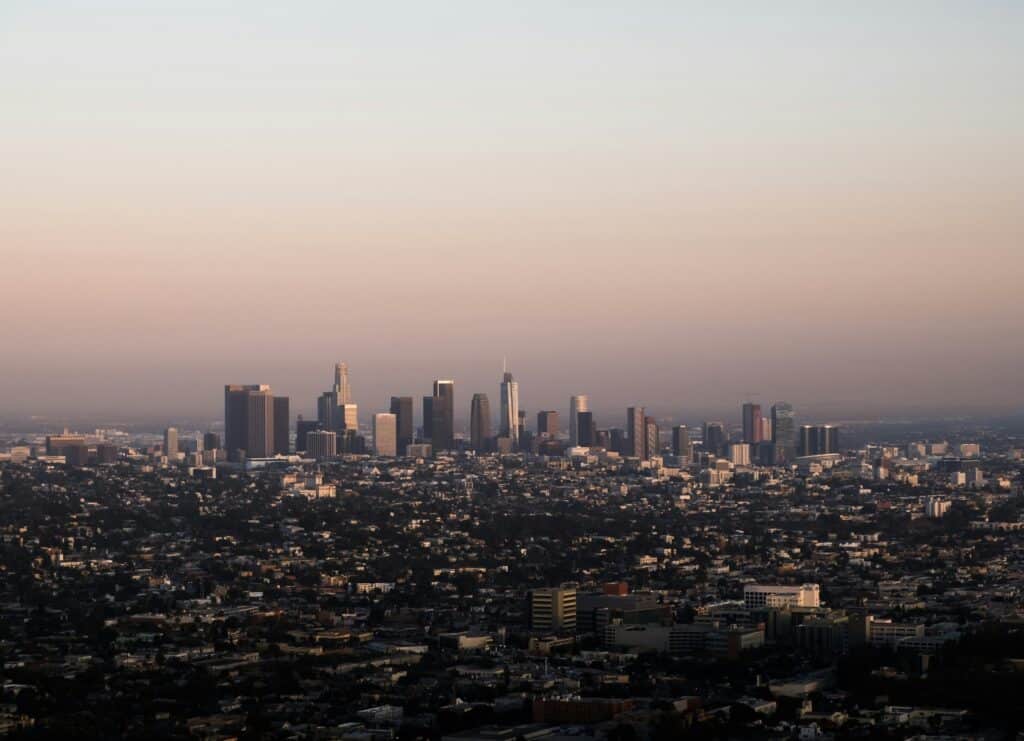 City scape of Los Angeles with an orange to pink sky