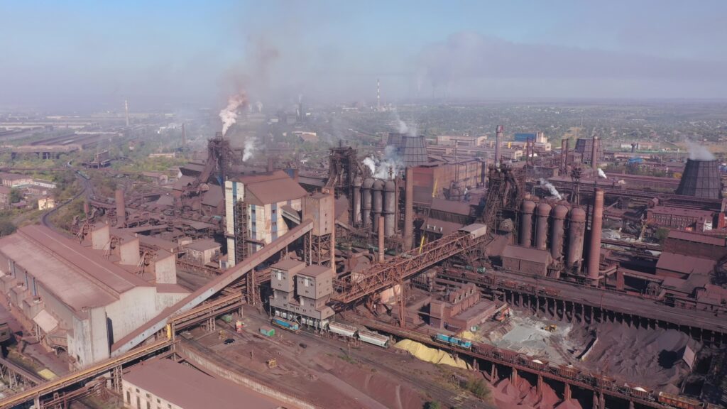 Aerial view of blast furnaces. Smog in the city.